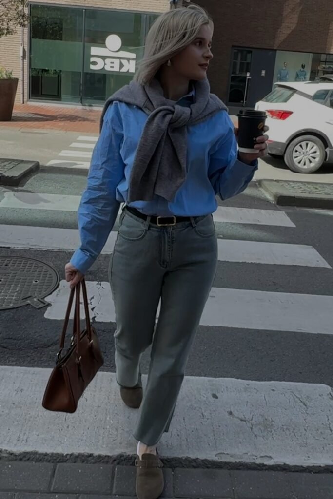 Blue Button-Down Shirt + Grey Sweater (shoulders) + Grey Slim-Fit Jeans + Brown Mules