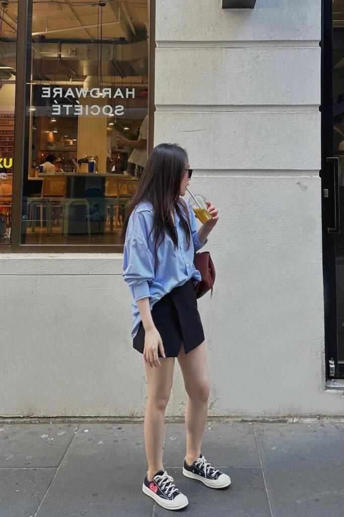 Blue Oversized Striped Shirt + Black Mini Skort + Black and White Sneakers