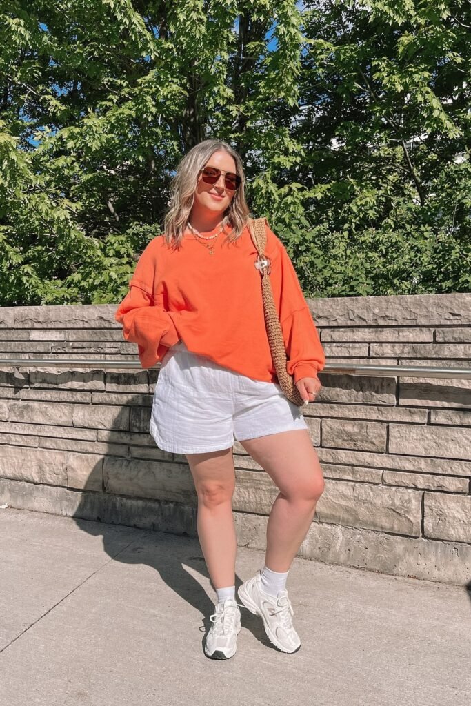 Bright Orange Oversized Sweatshirt + White Linen Shorts + White Chunky Sneakers