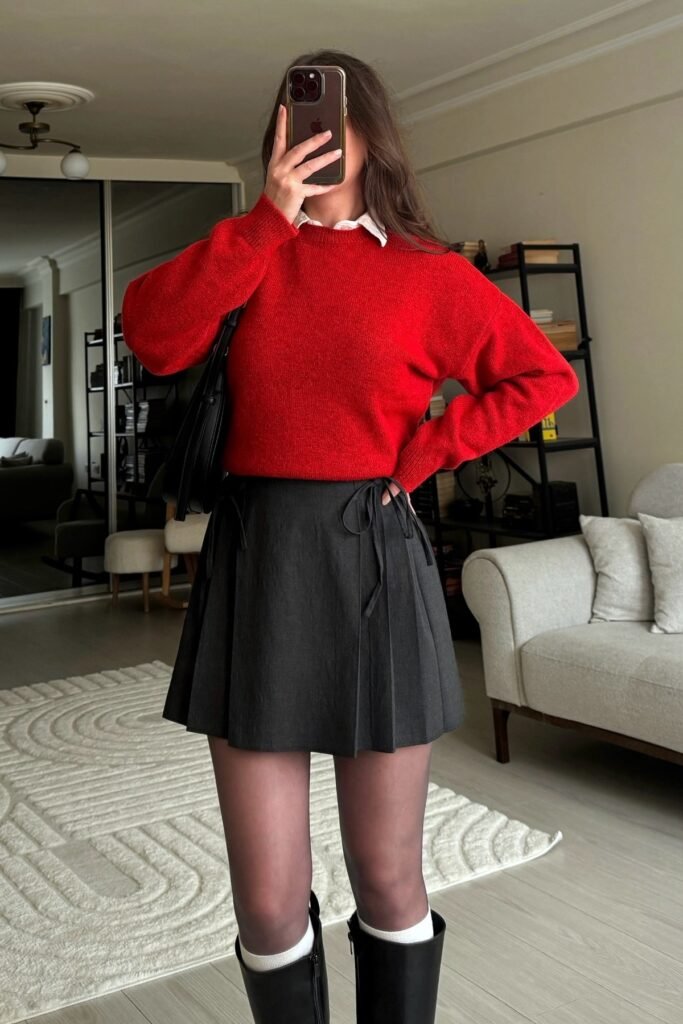 Bright Red Crewneck Sweater + Black Pleated Mini Skirt + Black Tights + Knee-High Boots