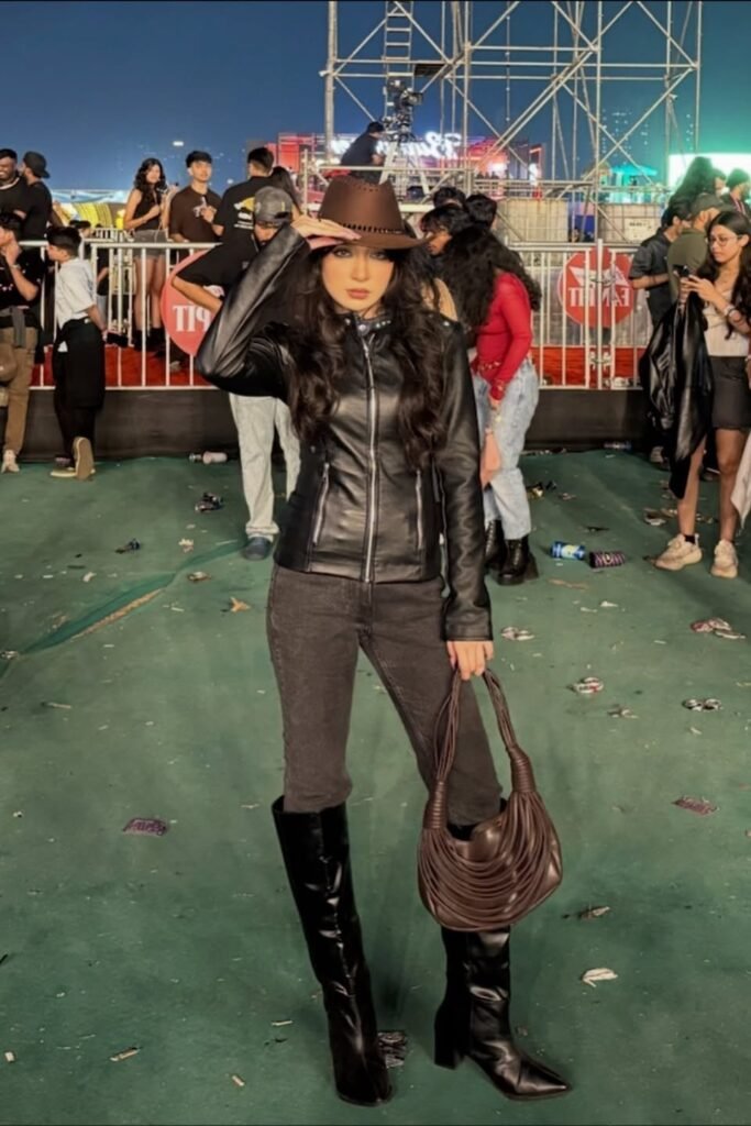 Brown Cowboy Hat + Black Leather Zip-Up Jacket + Dark Grey Straight-Leg Jeans + Black Knee-High Boots