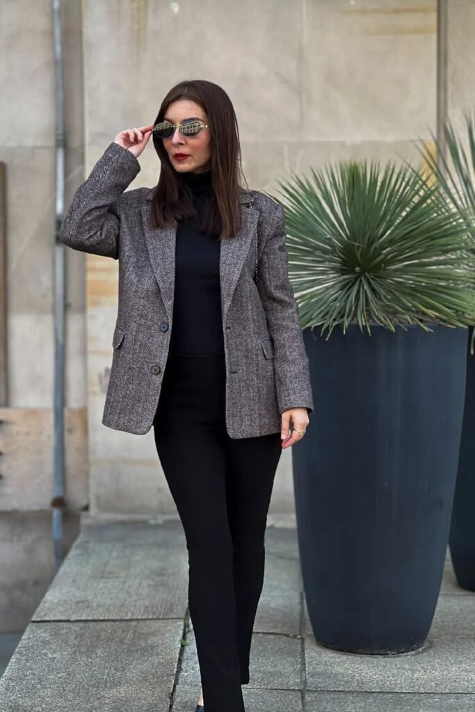 Brown Herringbone Blazer + Black Mock-Neck Top + Black Skinny Trousers + Black Pointed-Toe Flats
