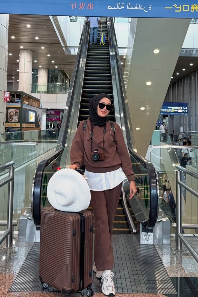 Dark Brown Utility Jacket + White T-Shirt + Black Flared Trousers + White Slip-on Shoes