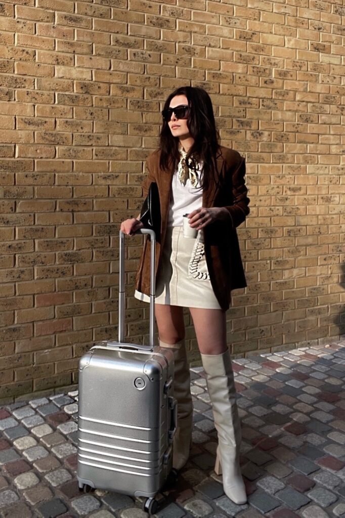 Brown Suede Blazer + White Graphic T-Shirt + Cream Leather Mini Skirt + Cream Knee-High Boots