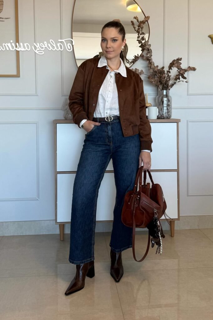 Brown Suede Bomber Jacket + White Button-Down Shirt + Dark Indigo Jeans + Brown Heeled Boots
