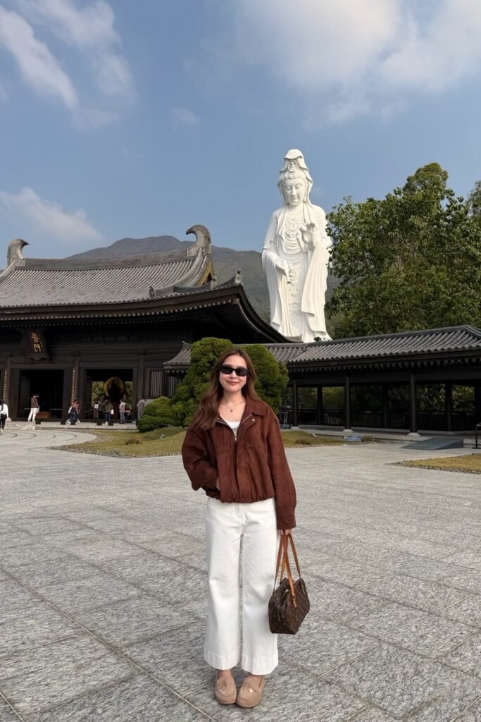 Brown Suede Bomber Jacket + White Wide-Leg Trousers + Beige Loafers + Monogram Tote Bag