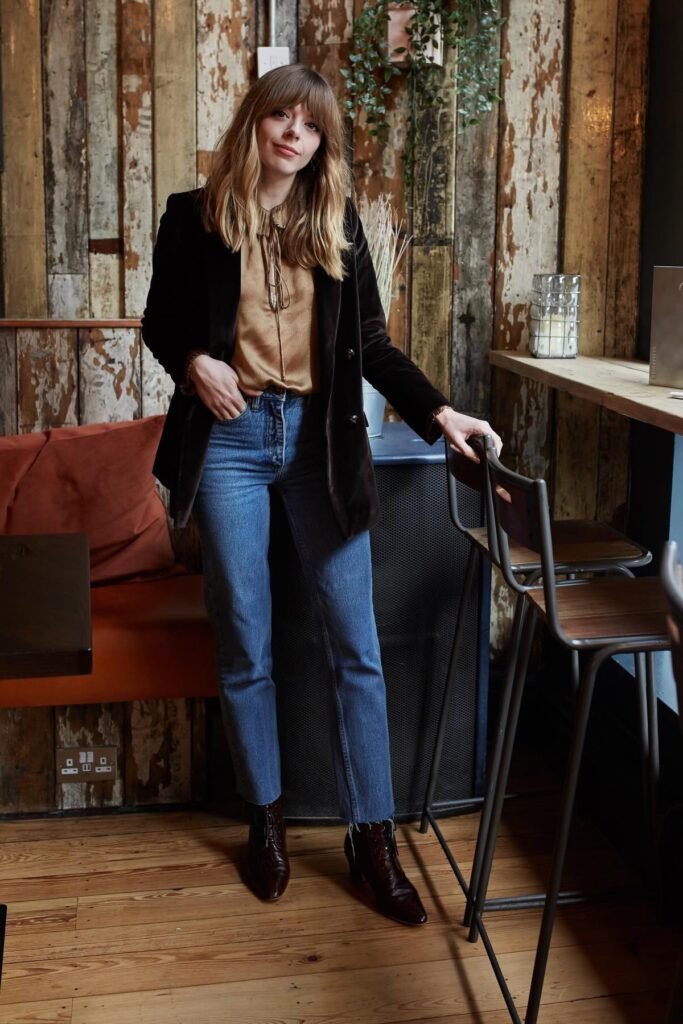 Brown Velvet Blazer + Gold Silk Blouse + Blue Straight-leg Jeans + Dark Brown Boots