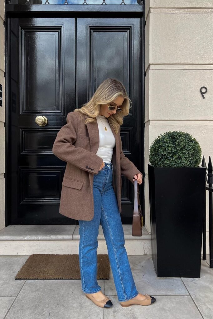 Brown Wool Blazer + White Mock Neck Top + Medium Wash Straight Jeans + Beige and Black Cap-Toe Ballet Flats