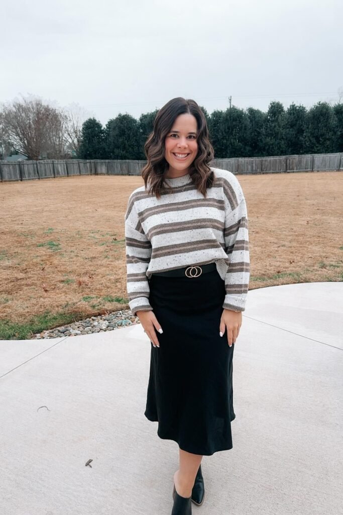 Brown and Grey Striped Sweater + Black Satin Midi Skirt + Black Leather Ankle Boots