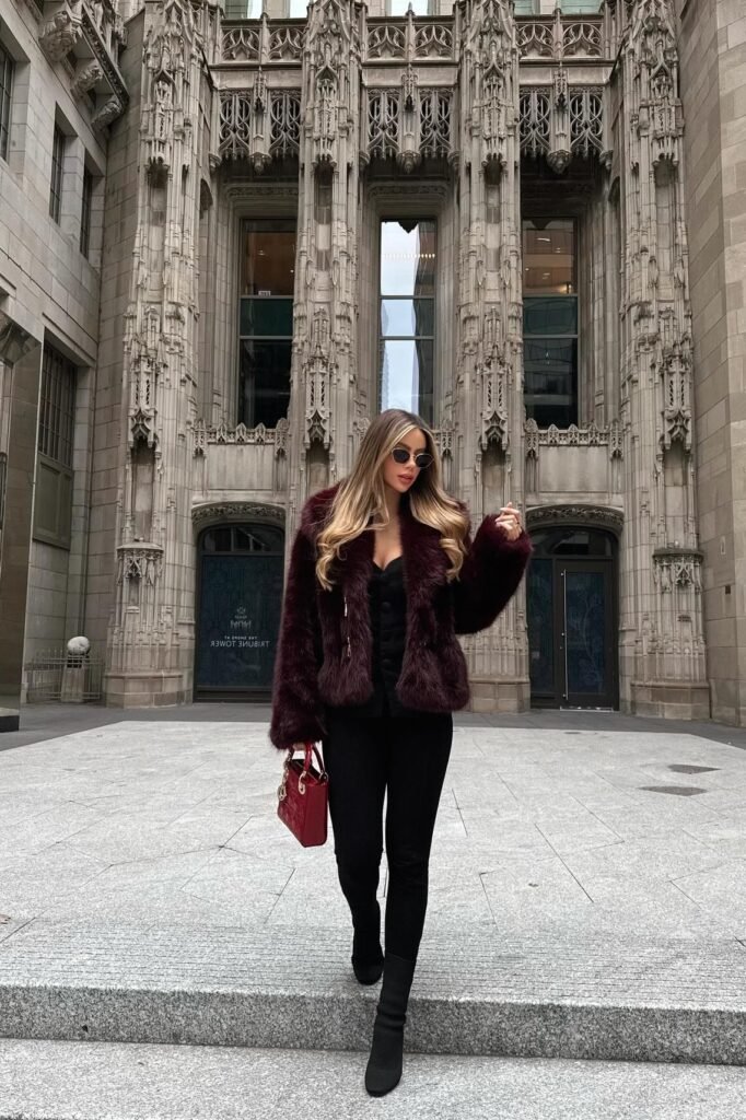 Burgundy Faux Fur Coat + Black Top + Black Skinny Jeans + Black Sock Boots