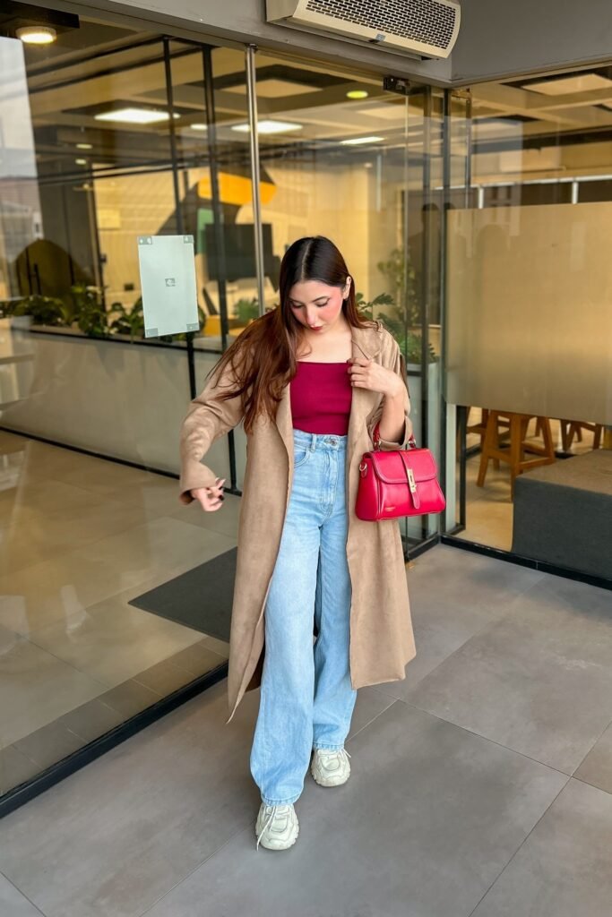 Burgundy Square-Neck Bodysuit + Light Wash Wide-Leg Jeans + Tan Trench Coat + White Chunky Sneakers