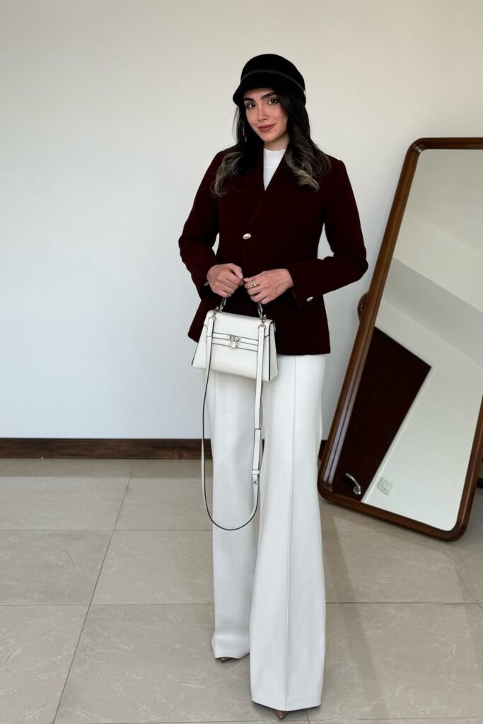 Burgundy Structured Blazer + White Mock-Neck Top + White Wide-Leg Trousers + White Top-Handle Bag
