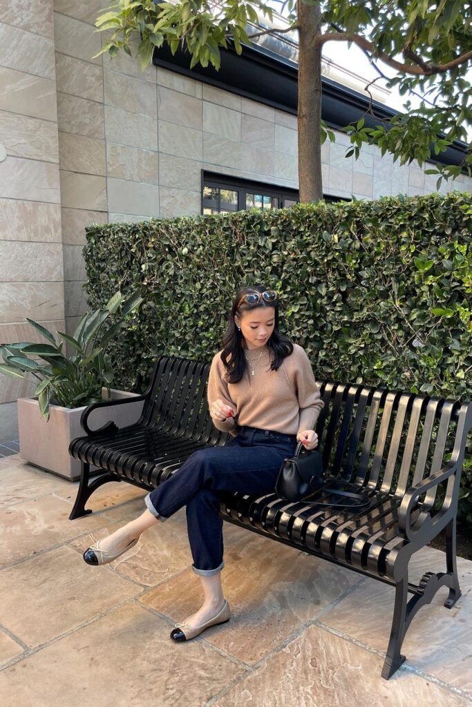 Camel Crewneck Sweater + Cuffed Dark Wash Jeans + Beige and Black Cap-Toe Ballet Flats