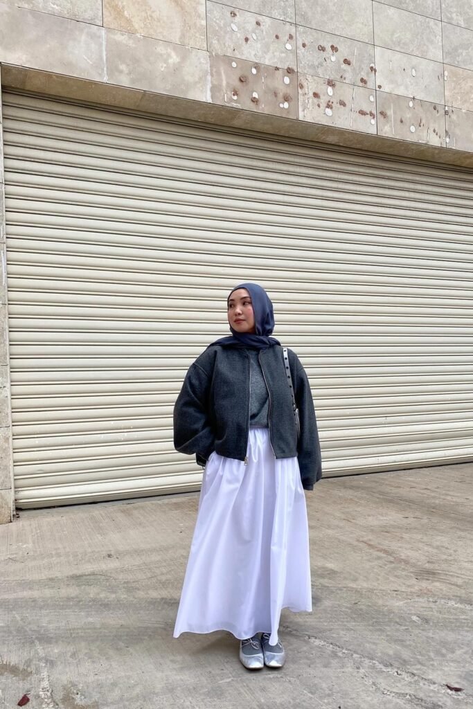 Charcoal Bomber Jacket + Grey Knit Top + White Maxi Skirt + Silver Mary Janes