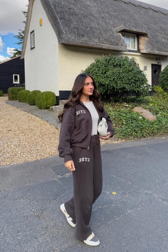 Black Crewneck Sweater + Beige Shoulder Tied Sweater + White Straight Leg Jeans + Tan Suede Boots