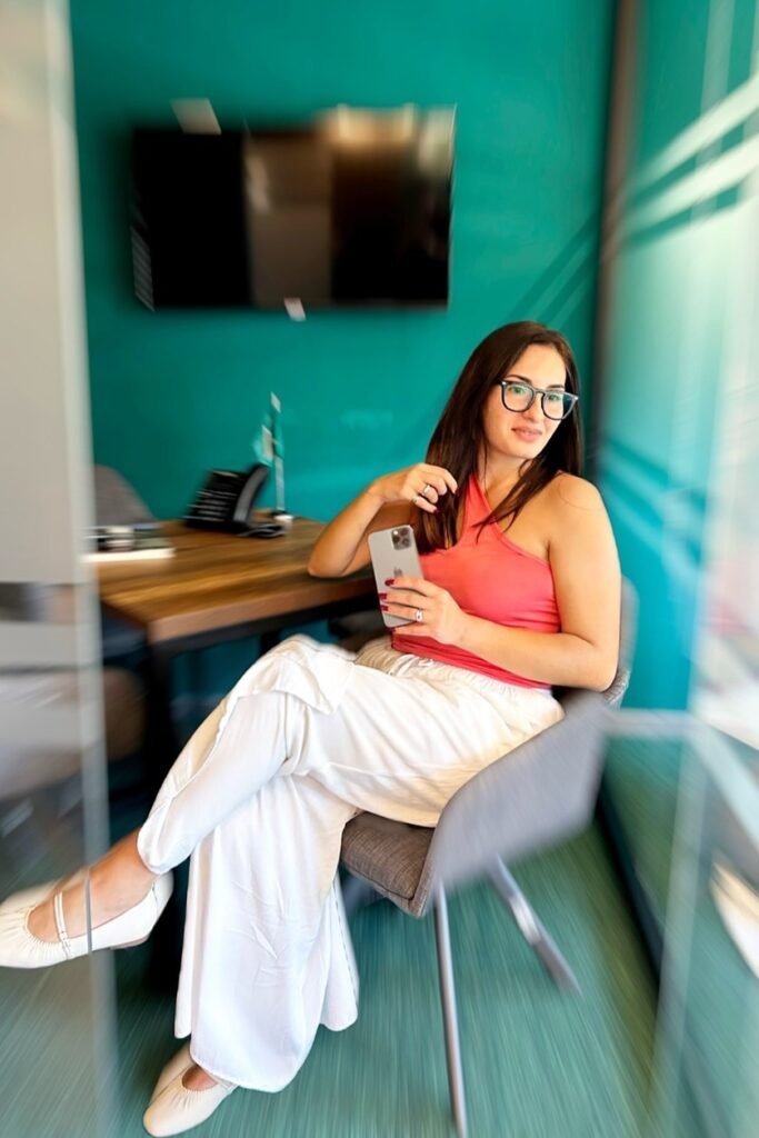 Coral One-Shoulder Tank + White Wide-Leg Trousers + White Ruched Flats