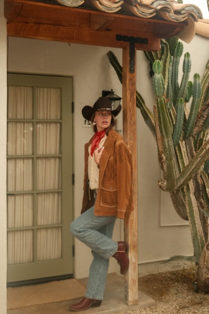 Cream Button-Down Shirt + Brown Fringe Suede Jacket + Light Wash Straight-Leg Jeans