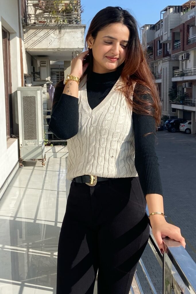 Cream Cable Knit Vest + Black Long-Sleeve Turtleneck + Black Trousers