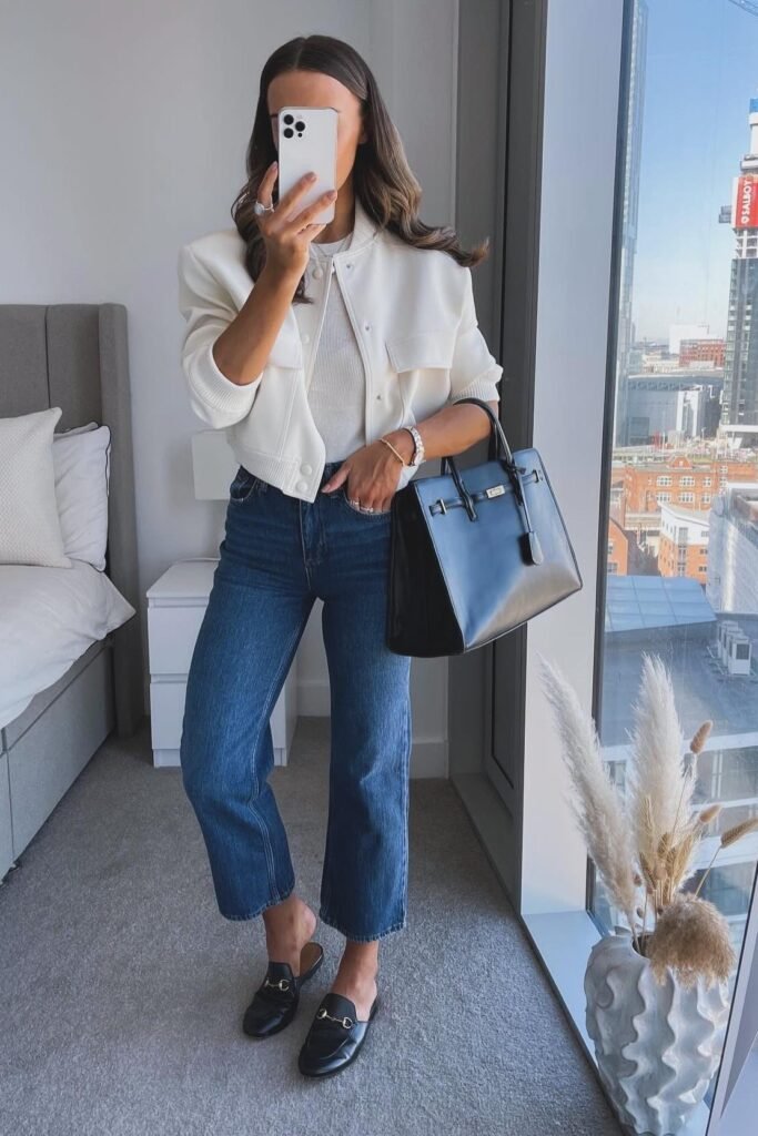 Cream Cropped Bomber Jacket + White Ribbed Tee + Medium Wash Cropped Jeans + Black Horsebit Mules