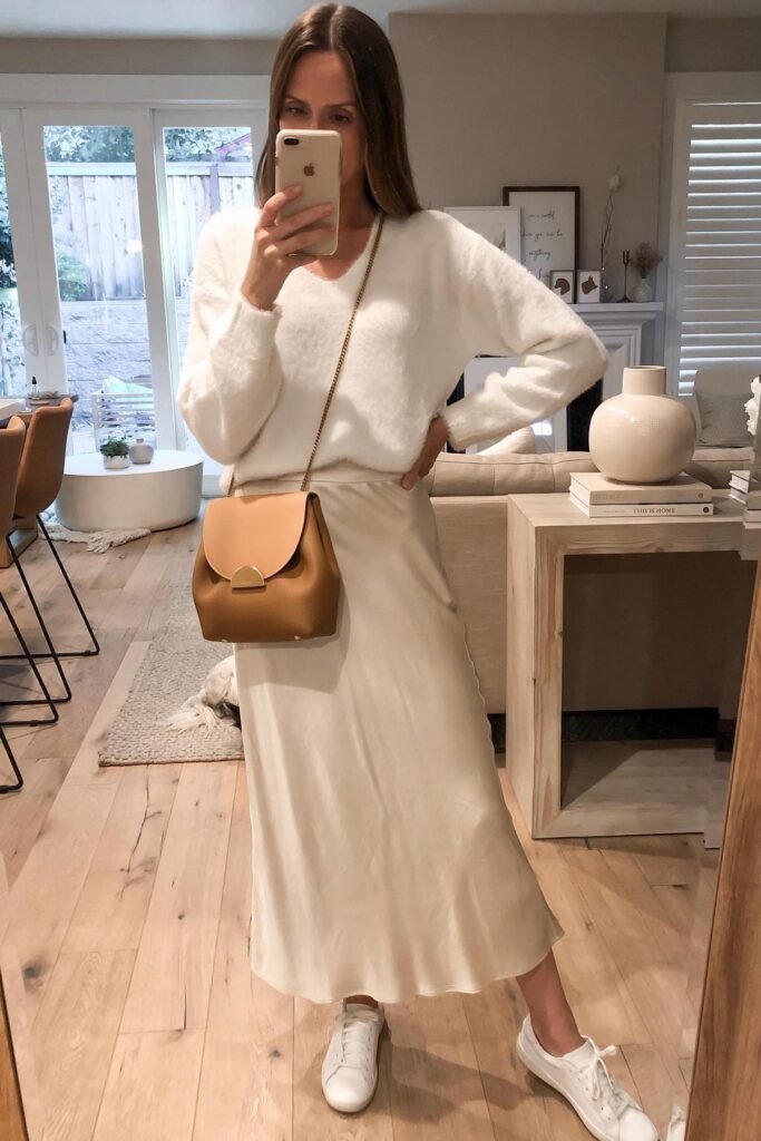 Cream Fuzzy V Neck Sweater + Champagne Silk Midi Skirt + White Sneakers