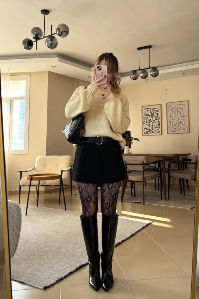 Cream High-Neck Sweater + Black Mini Skirt + Lace Patterned Tights + Tall Black Pointed Boots