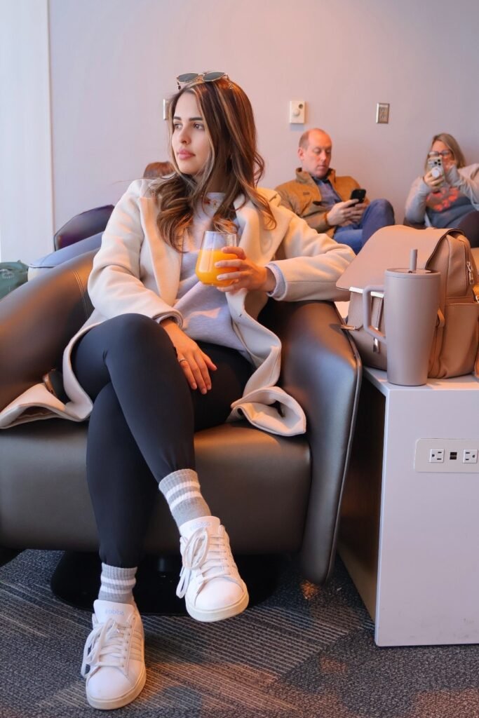 Cream Long Coat + Grey Sweatshirt + Black Leggings + White Sneakers