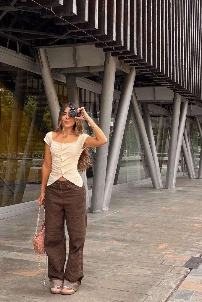 Cream Ruched Cap-Sleeve Top + Brown Wide-Leg Cargo Pants + Pink Quilted Bag