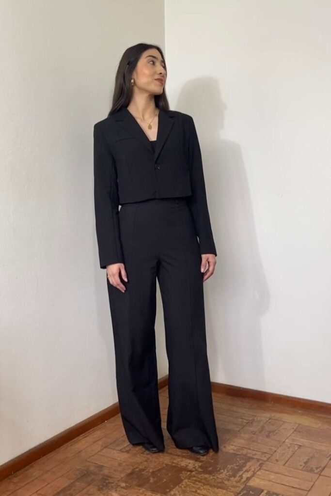 Cropped Black Blazer + Black Wide-Leg Trousers + Gold Pendant Necklace + Black Boots