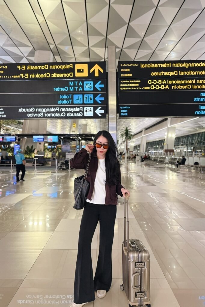 Dark Brown Utility Jacket + White T-Shirt + Black Flared Trousers + White Slip-on Shoes