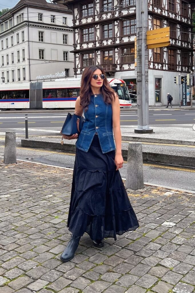 Denim Button-up Vest + Black Tiered Maxi Skirt + Black Leather Boots