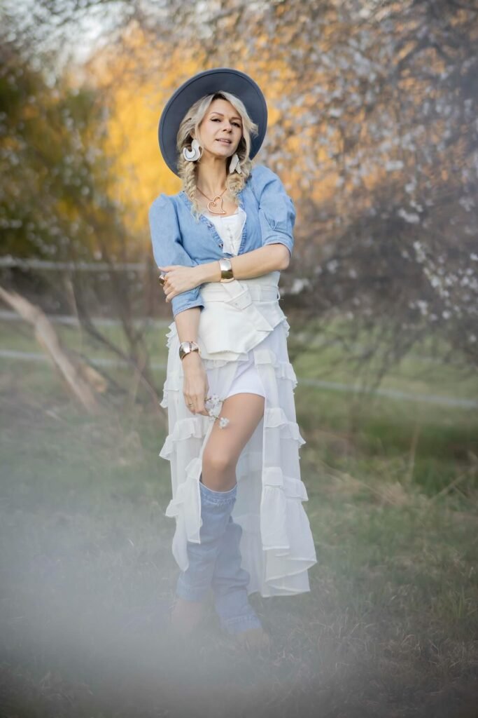Denim Puff-Sleeve Top + White Ruffled High-Low Skirt + Denim Boots