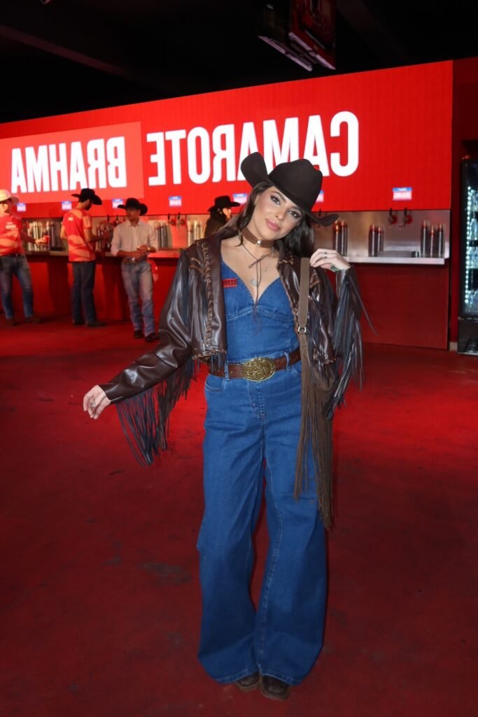 Denim V-Neck Jumpsuit + Brown Fringe Leather Jacket + Brown Square-Toe Boots