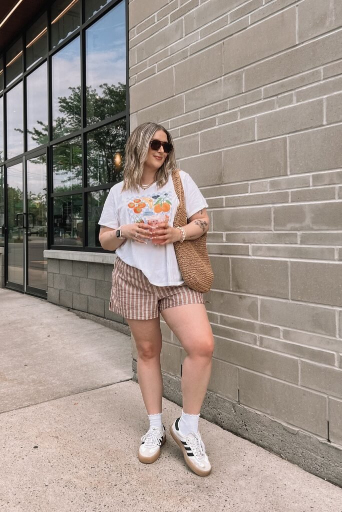 Fruit Graphic T Shirt + Brown Striped Shorts + White Adidas Samba Sneakers