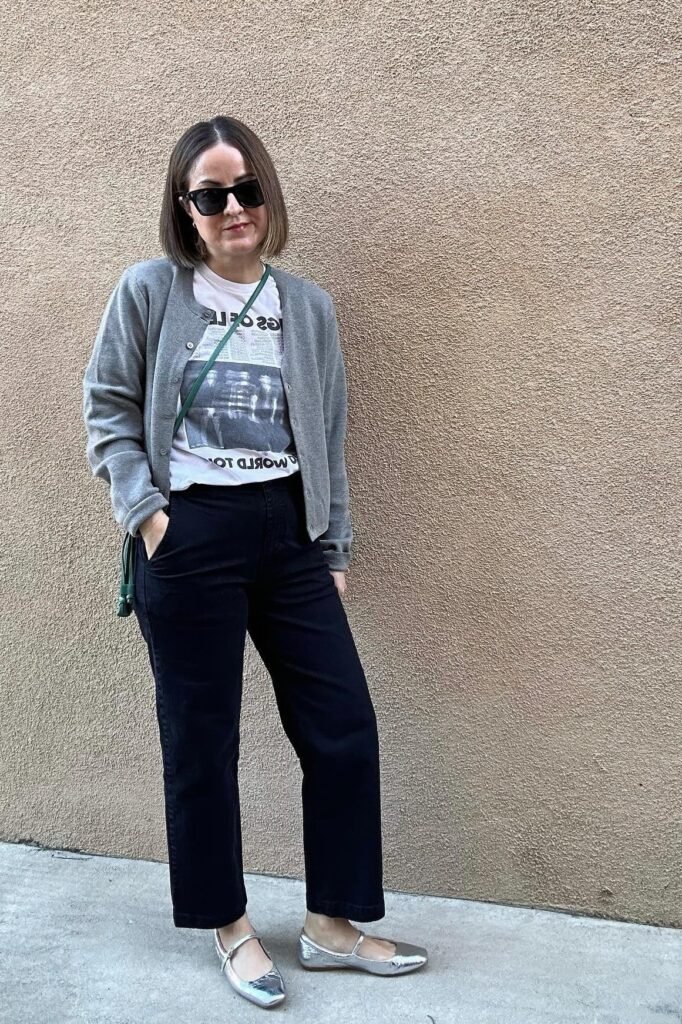 Graphic T Shirt + Grey Cardigan + Black Straight Leg Trousers + Silver Mary Jane Flats