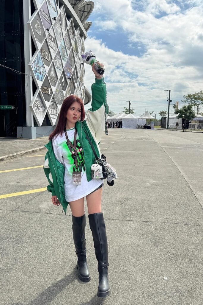 Green and White Varsity Jacket + Oversized Graphic T-shirt + Black Over-the-Knee Boots