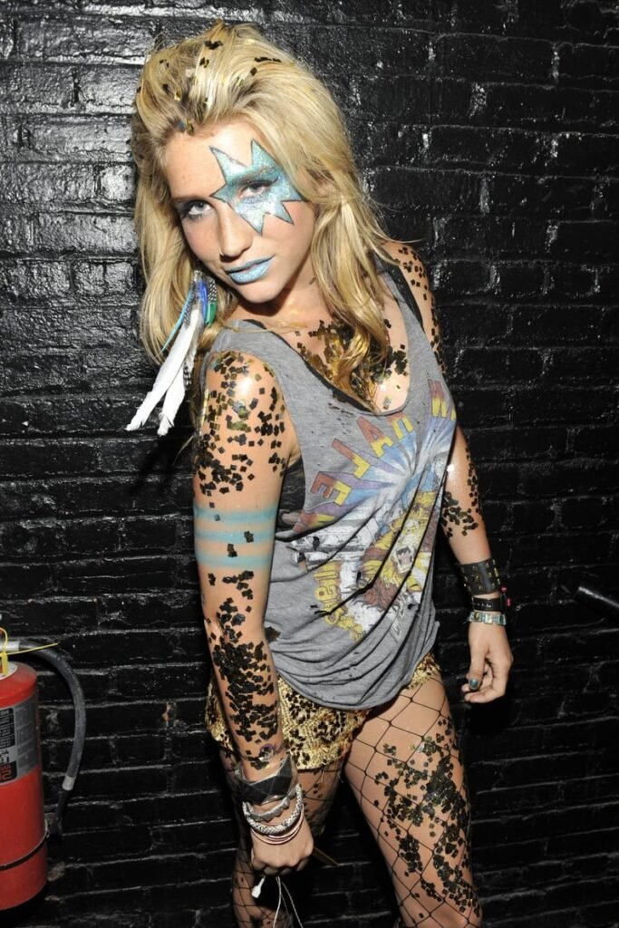 Grey Graphic Muscle Tank + Gold Sequin Shorts + Blue Star Face Paint