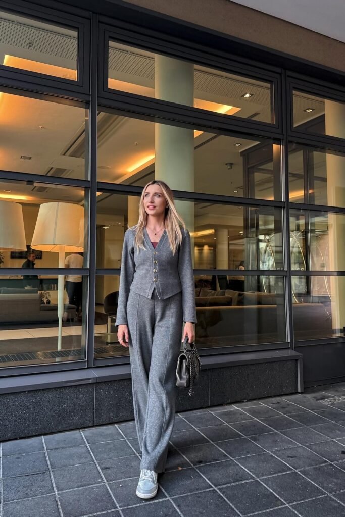 Grey Knit Button-Up Cardigan + Matching Grey Wide-Leg Trousers + White Sneakers + Dark Grey Chain Bag