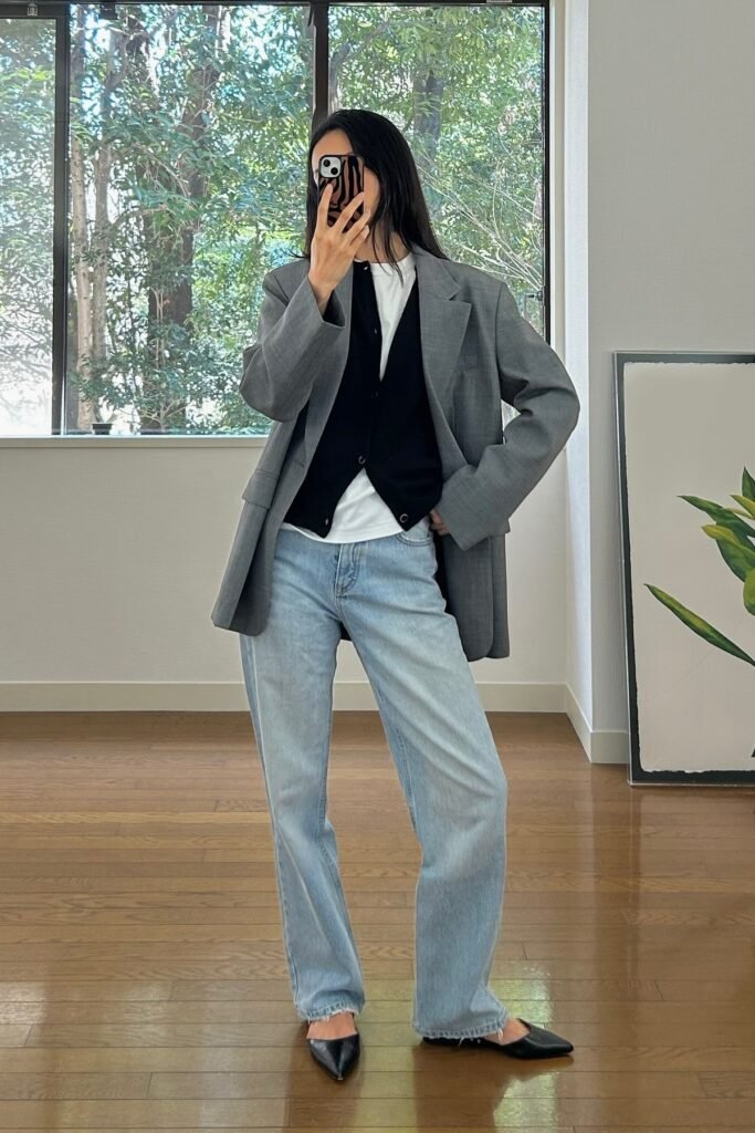 Grey Oversized Blazer + Black Waistcoat + White T Shirt + Light Wash Jeans + Black Pointed Flats