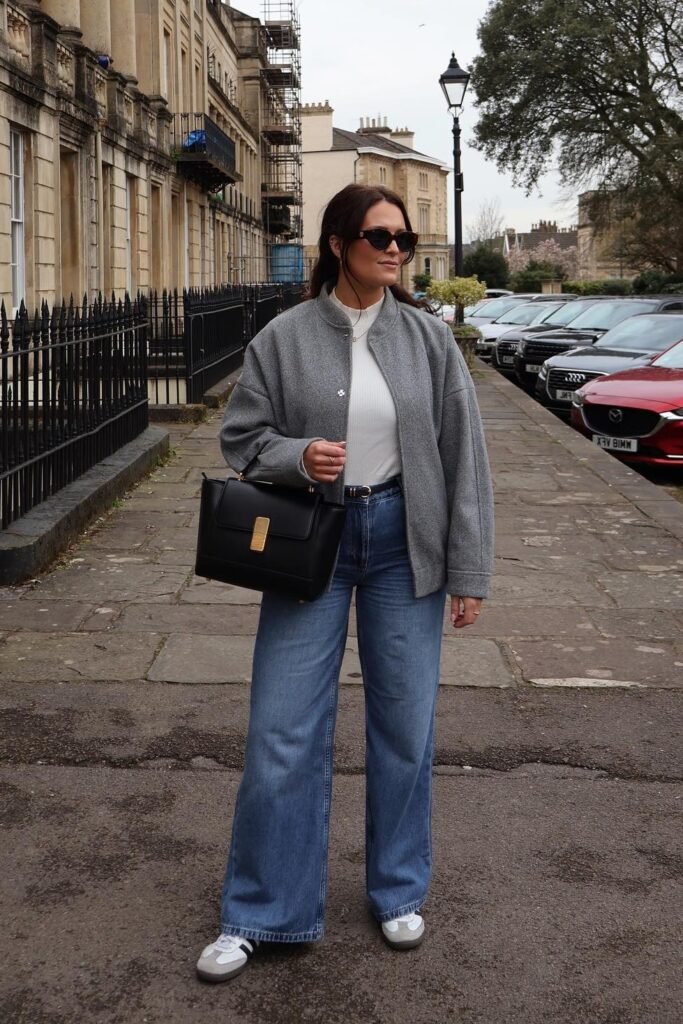 Grey Wool Bomber Jacket + White High Neck Top + Wide Leg Blue Jeans + White Sneakers