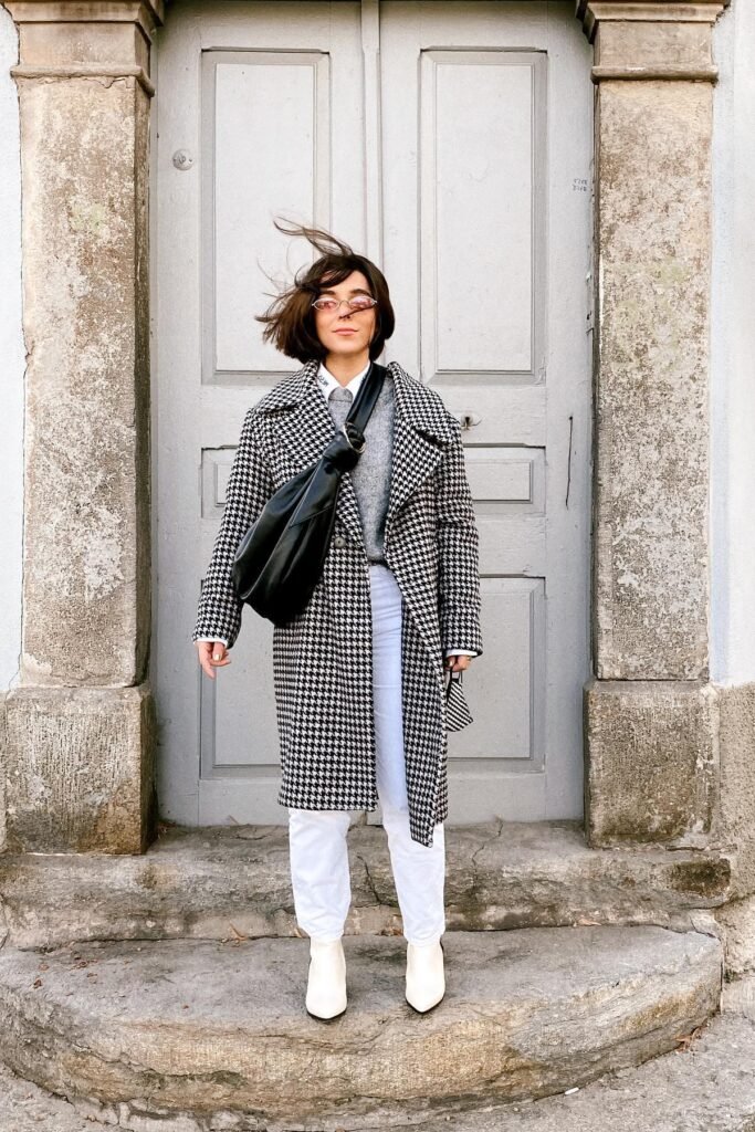 Houndstooth Pattern Long Coat + Grey Sweater + White Jeans + White Ankle Boots