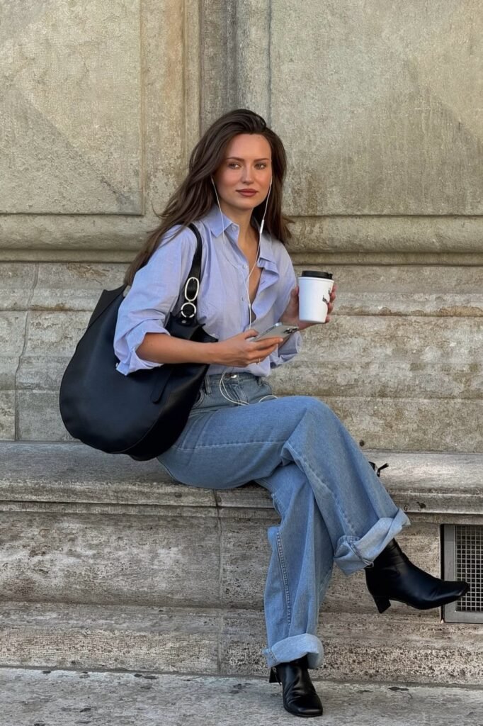 Light Blue Button-Down Shirt + Oversized Light Wash Jeans + Black Leather Ankle Boots