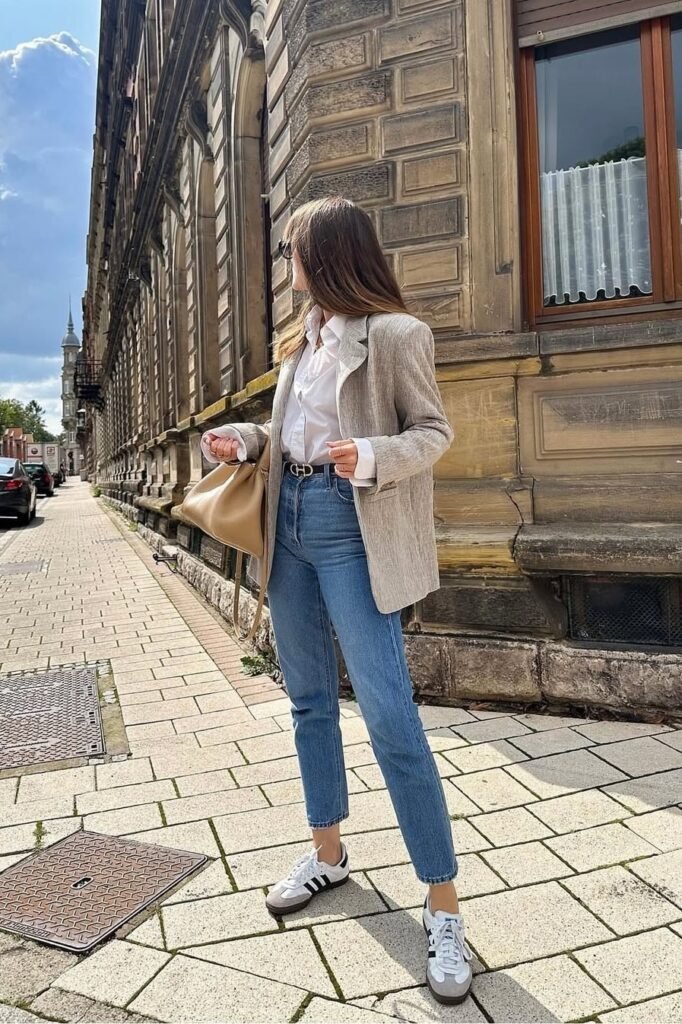 Light Grey Textured Blazer + White Button-Down Shirt + Medium Wash Straight-Leg Jeans + Black and White Sneakers