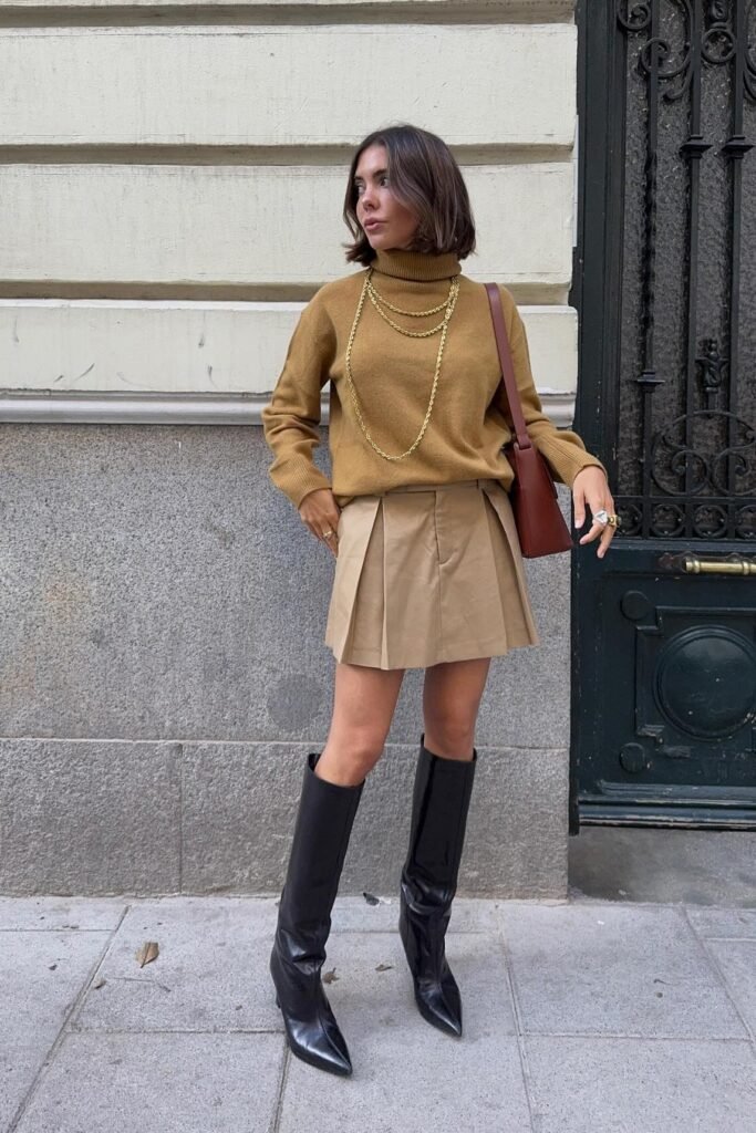 Mustard Turtleneck Sweater + Beige Pleated Mini Skirt + Black Knee High Boots