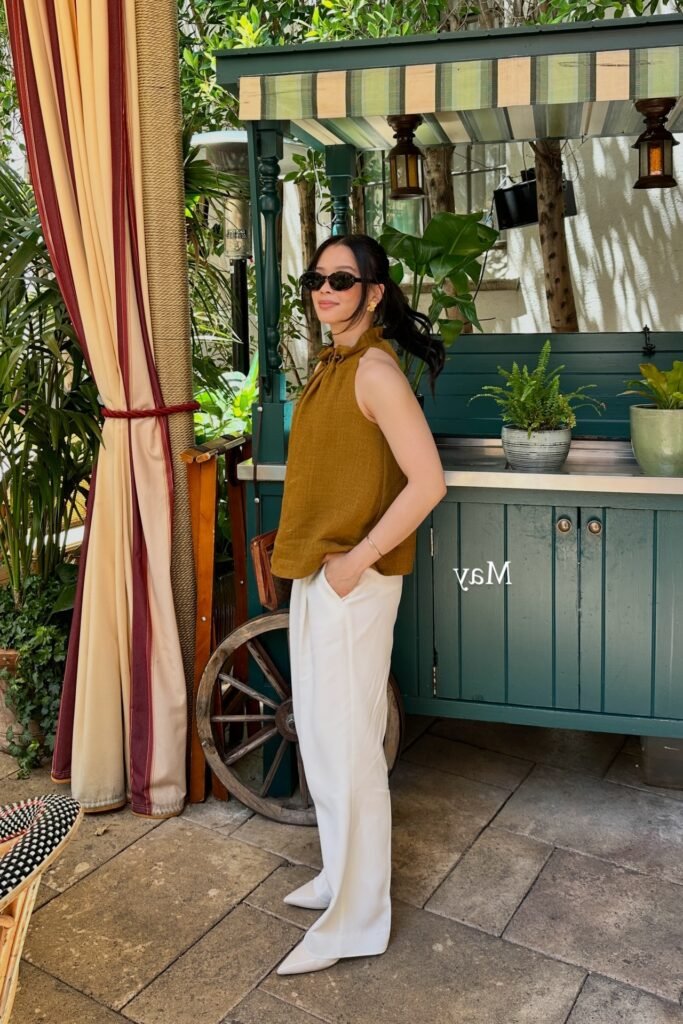 Mustard Yellow Sleeveless Ruffle-Neck Top + White Wide-Leg Trousers + White Pointed-Toe Heels