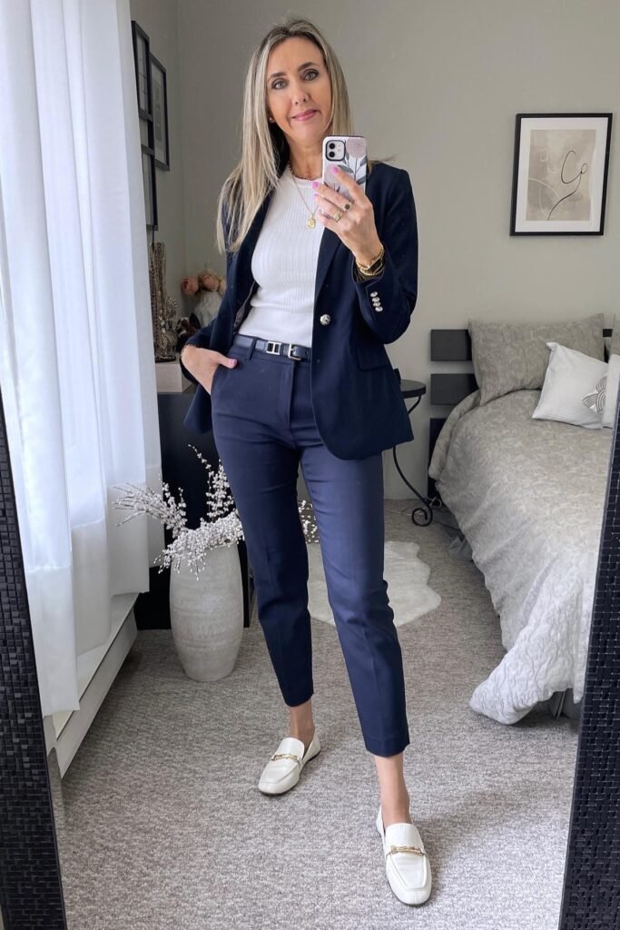 Navy Blue Blazer + White Ribbed Mock-Neck Top + Navy Cropped Trousers + White Horsebit Loafers