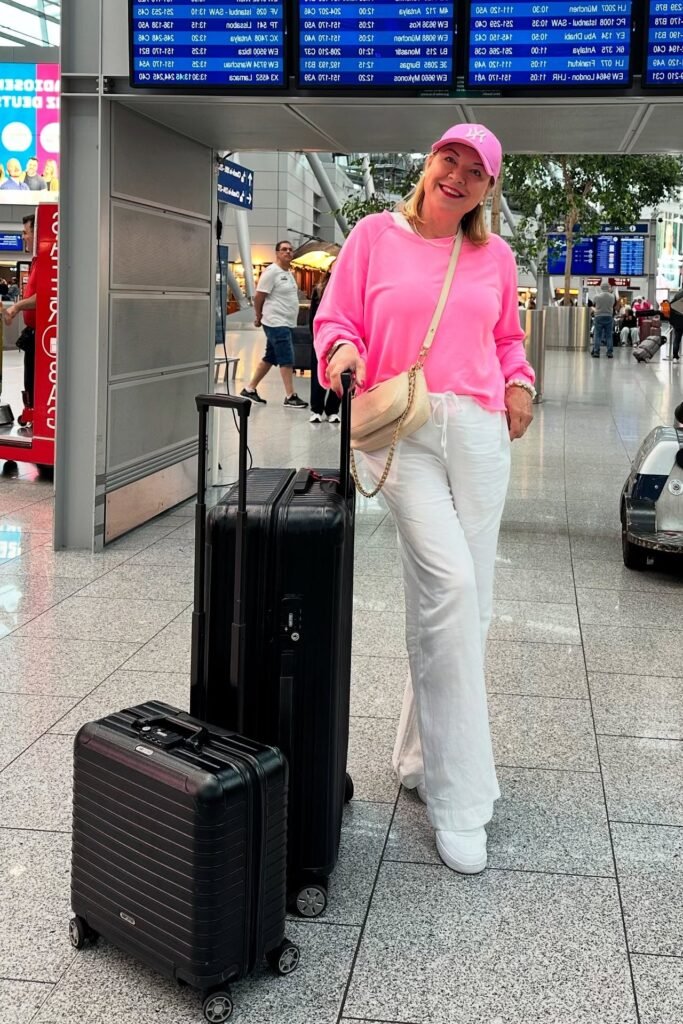 Neon Pink Crewneck Sweatshirt + White Wide-Leg Linen Pants + White Sneakers