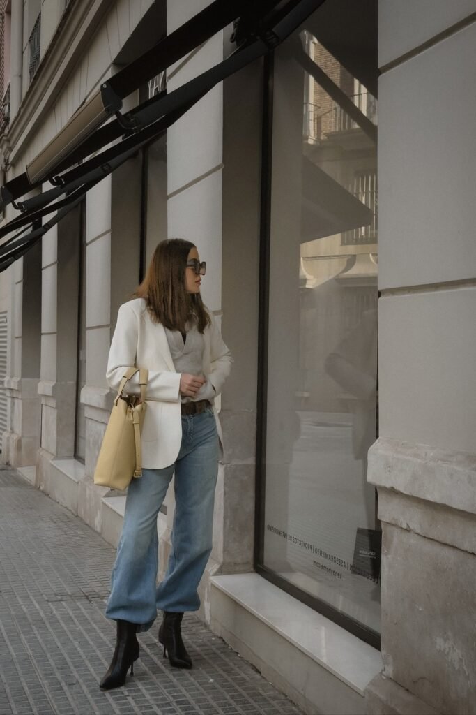 Off White Blazer + Grey Top + Light Wash Wide Leg Jeans + Black Pointed Boots