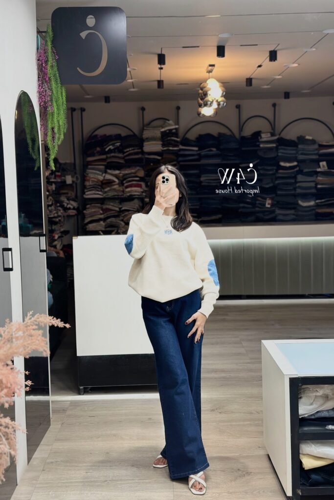 Off White Loewe Knit Sweater + Deep Blue Flared Jeans + White Strappy Sandals
