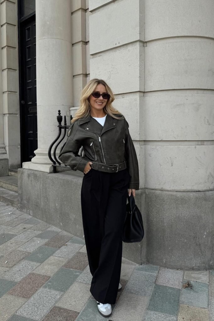 Olive Green Cropped Moto Jacket + White T-Shirt + Black Wide-Leg Trousers + White Retro Sneakers