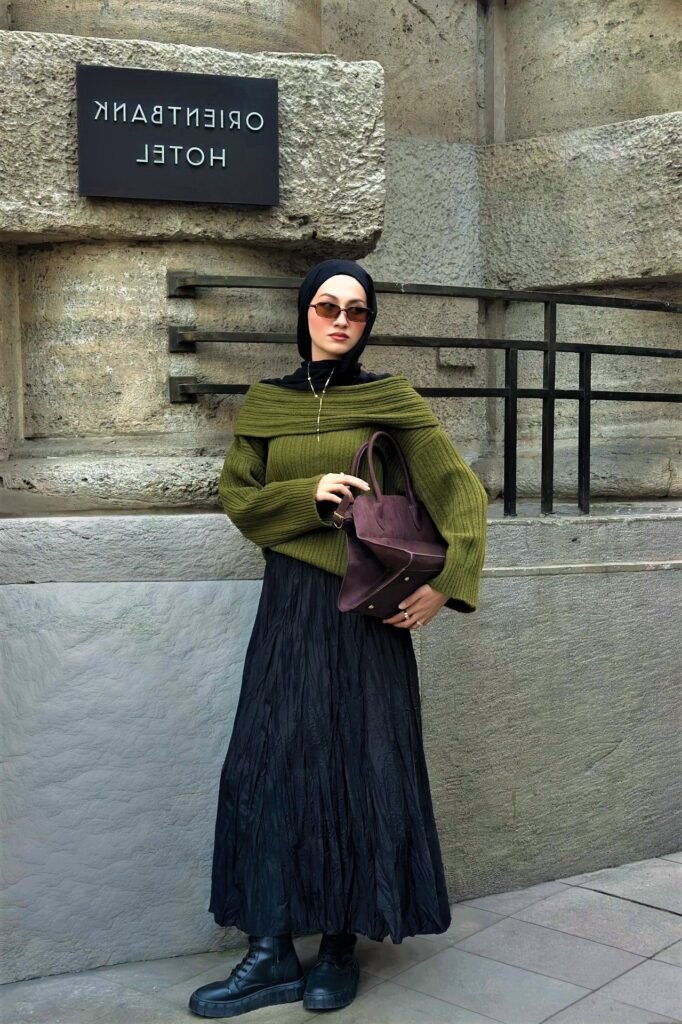 Olive Green Off-the-Shoulder Sweater + Black Crinkled Maxi Skirt + Dark Purple Leather Handbag + Black Chunky Boots
